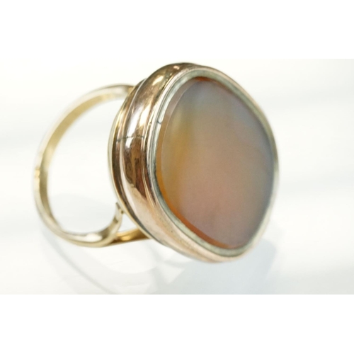 201 - Agate 9ct rose and yellow gold ring, the oval agate panel measuring approx 23mm x 18mm, rubover set,... 