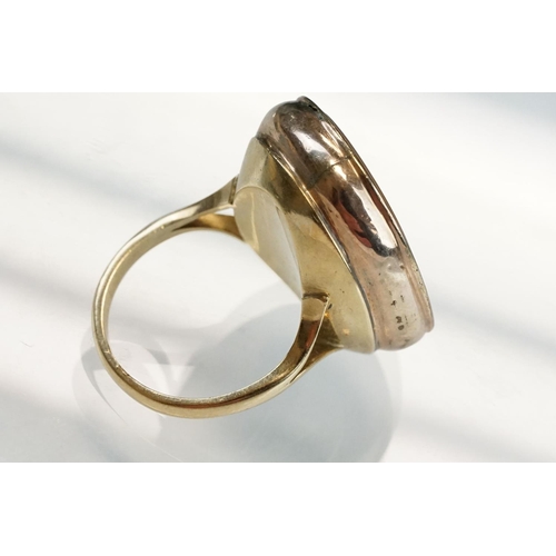 201 - Agate 9ct rose and yellow gold ring, the oval agate panel measuring approx 23mm x 18mm, rubover set,... 