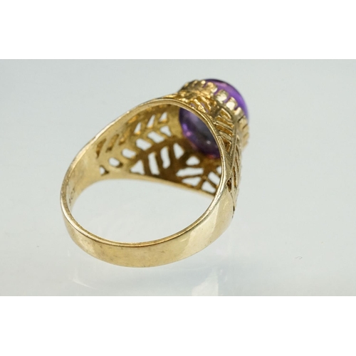 202 - Amethyst 9ct yellow gold ring, the oval cabochon cut amethyst measuring approx 10mm x 8mm, claw coll... 