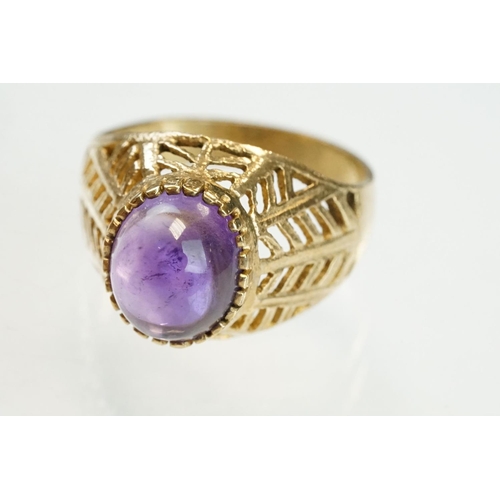 202 - Amethyst 9ct yellow gold ring, the oval cabochon cut amethyst measuring approx 10mm x 8mm, claw coll... 