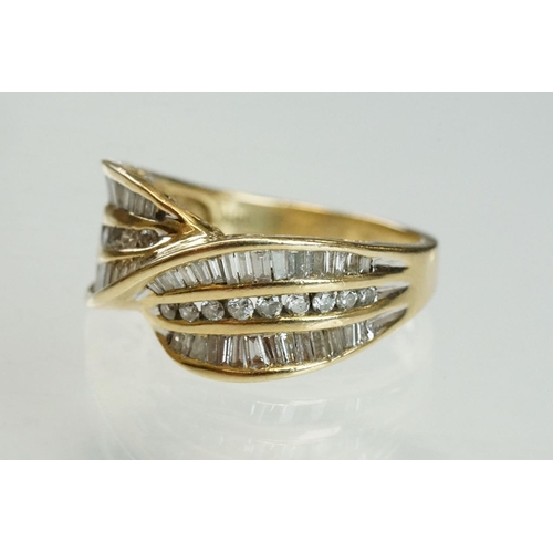 203 - Diamond 14ct yellow gold crossover ring, eighteen small round brilliant cut diamonds with two rows o... 