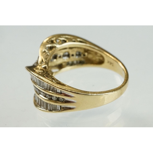 203 - Diamond 14ct yellow gold crossover ring, eighteen small round brilliant cut diamonds with two rows o... 