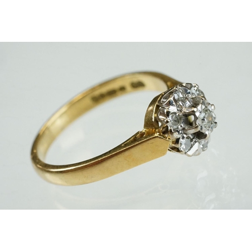 206 - Diamond 18ct yellow gold flower head ring, central round brilliant cut diamond weighing approx 0.05 ... 