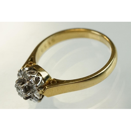 206 - Diamond 18ct yellow gold flower head ring, central round brilliant cut diamond weighing approx 0.05 ... 