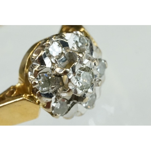 206 - Diamond 18ct yellow gold flower head ring, central round brilliant cut diamond weighing approx 0.05 ... 