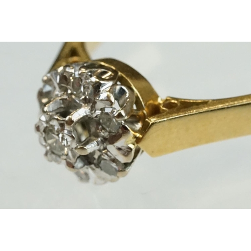 206 - Diamond 18ct yellow gold flower head ring, central round brilliant cut diamond weighing approx 0.05 ... 