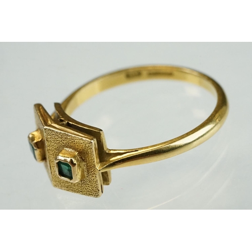 210 - Emerald 18ct yellow gold ring, two textured square heads, each containing a small square mixed cut e... 