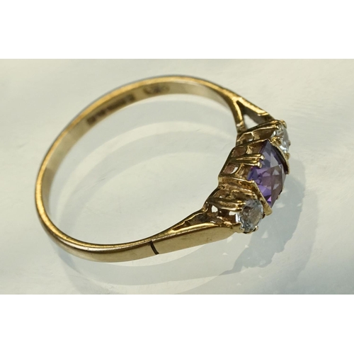 215 - Amethyst and cubic zirconia 9ct yellow gold three stone ring, size P½; an amethyst 9ct yellow gold d... 