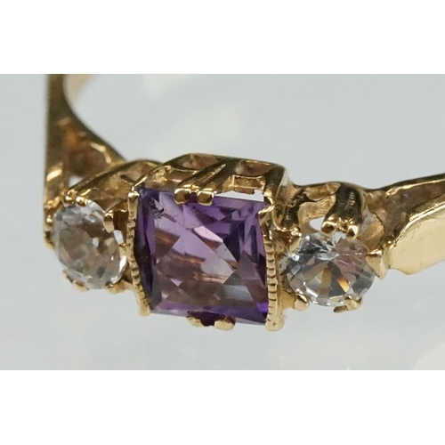 215 - Amethyst and cubic zirconia 9ct yellow gold three stone ring, size P½; an amethyst 9ct yellow gold d... 