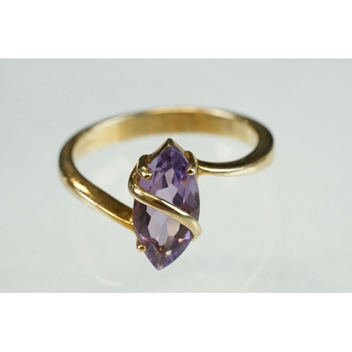 215 - Amethyst and cubic zirconia 9ct yellow gold three stone ring, size P½; an amethyst 9ct yellow gold d... 