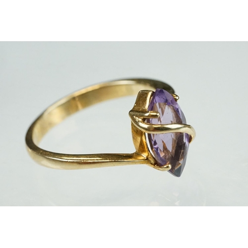 215 - Amethyst and cubic zirconia 9ct yellow gold three stone ring, size P½; an amethyst 9ct yellow gold d... 