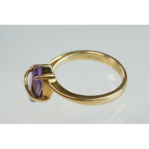 215 - Amethyst and cubic zirconia 9ct yellow gold three stone ring, size P½; an amethyst 9ct yellow gold d... 