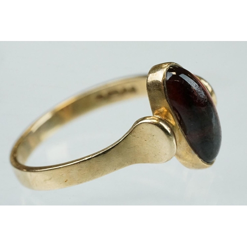 216 - Garnet 9ct yellow gold ring, oval cabochon cut garnet measuring approx 11.5mm x 5mm, rubover set, st... 