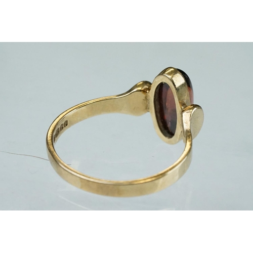 216 - Garnet 9ct yellow gold ring, oval cabochon cut garnet measuring approx 11.5mm x 5mm, rubover set, st... 