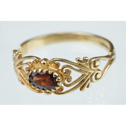 218 - Garnet 9ct yellow gold ring, the oval mixed cut garnet measuring approx 3.5mm x 6mm, claw set, pierc... 