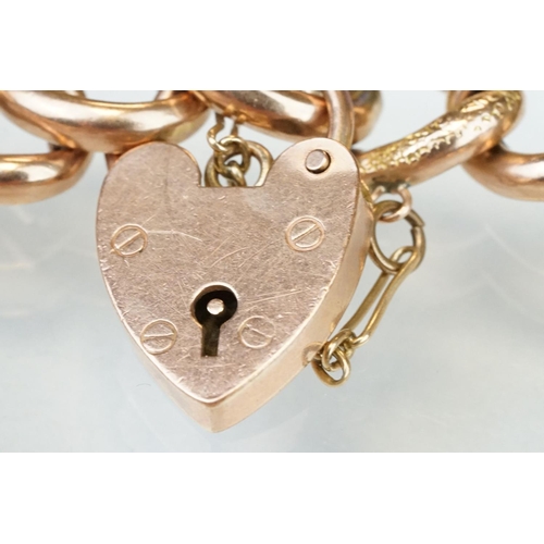 221 - 9ct rose gold curb link bracelet, textured alternate links, padlock clasp, each link stamped 9c