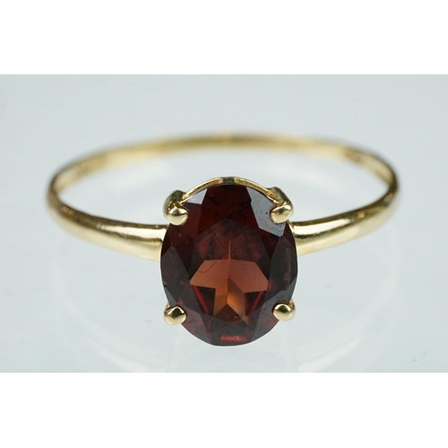 222 - Garnet 9ct yellow gold ring, the oval mixed cut garnet measuring approx 9.5mm x 7.5mm, claw set, rin... 