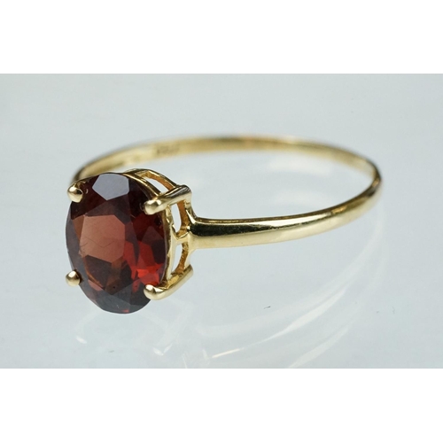 222 - Garnet 9ct yellow gold ring, the oval mixed cut garnet measuring approx 9.5mm x 7.5mm, claw set, rin... 