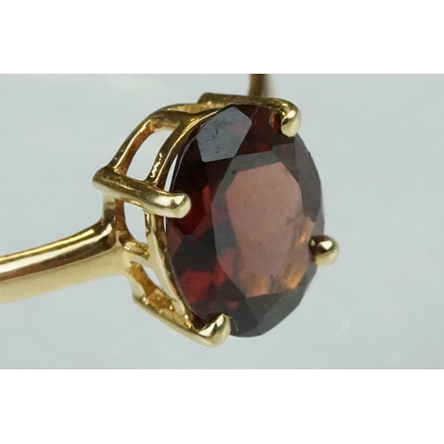 222 - Garnet 9ct yellow gold ring, the oval mixed cut garnet measuring approx 9.5mm x 7.5mm, claw set, rin... 