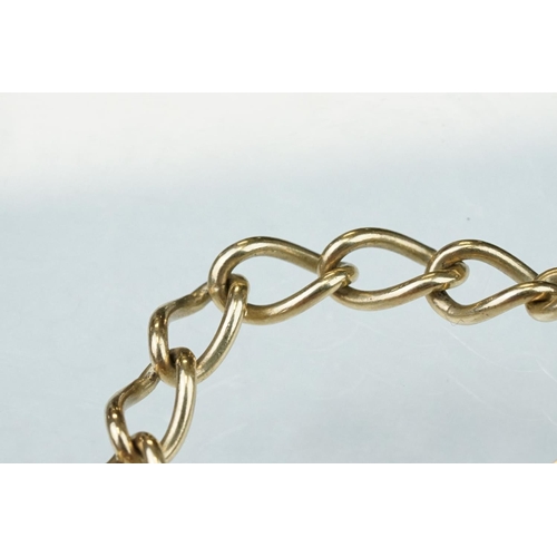 227 - 9ct yellow gold curb link bracelet, heart shaped padlock clasp