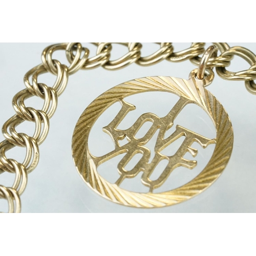 228 - 9ct yellow gold double curb link bracelet, padlock clasp,  with a 9ct gold charm