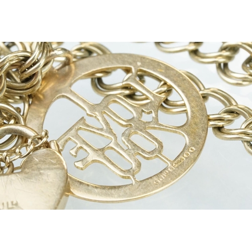 228 - 9ct yellow gold double curb link bracelet, padlock clasp,  with a 9ct gold charm