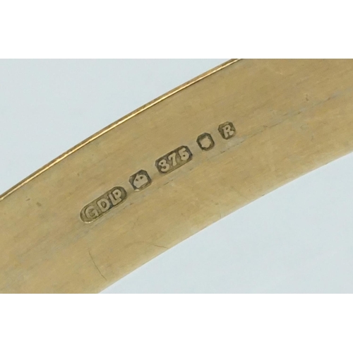 233 - 9ct yellow gold Christening bangle, engraved stylised foliate decoration, width approx 5mm