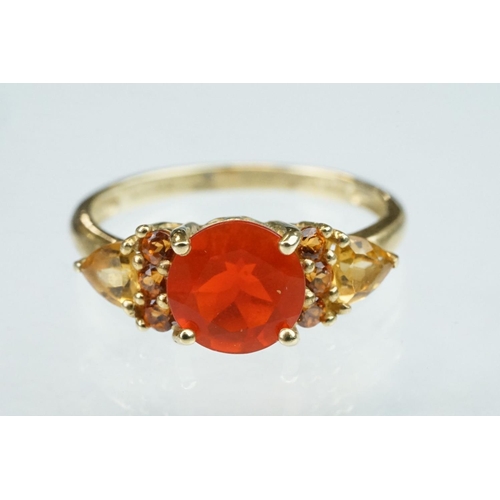 236 - Fire opal, orange garnet and citrine 14ct yellow gold ring, the round mixed cut fire opal diameter a... 