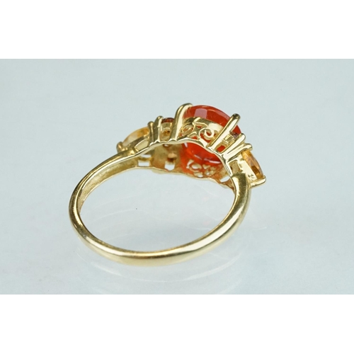 236 - Fire opal, orange garnet and citrine 14ct yellow gold ring, the round mixed cut fire opal diameter a... 