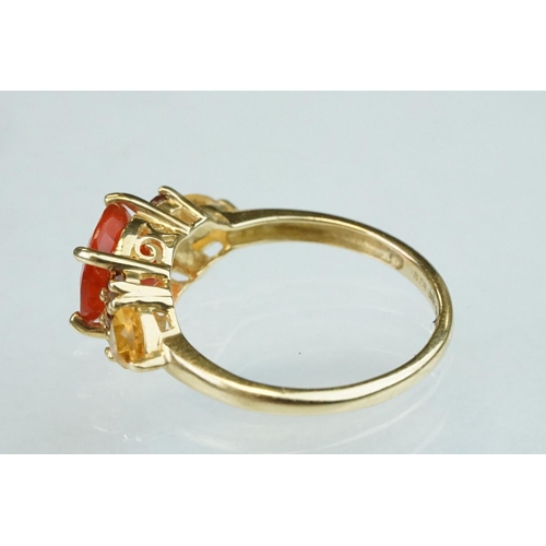 236 - Fire opal, orange garnet and citrine 14ct yellow gold ring, the round mixed cut fire opal diameter a... 