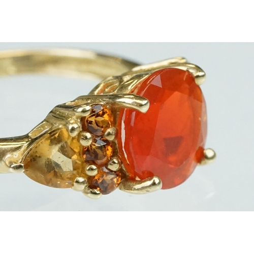 236 - Fire opal, orange garnet and citrine 14ct yellow gold ring, the round mixed cut fire opal diameter a... 