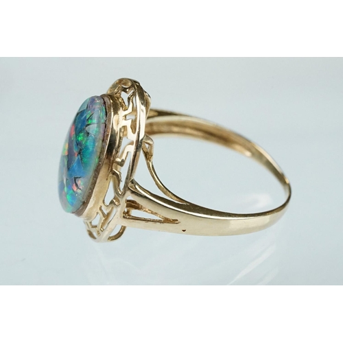 237 - Opal triplet 10ct yellow gold ring, the central panel measuring approx 14mm x 10mm, rub over set, pi... 