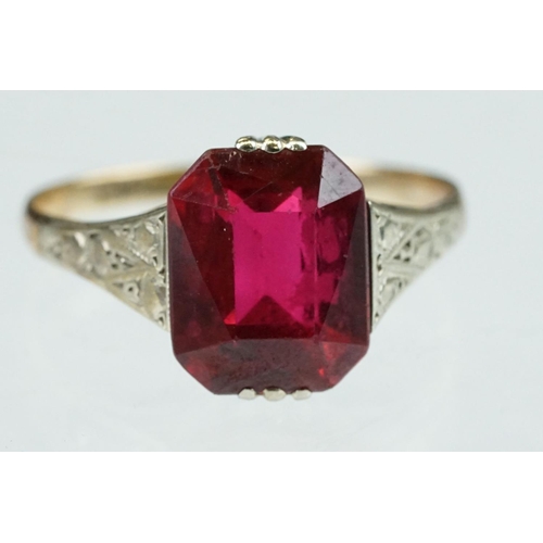 242 - Synthetic ruby 9ct gold dress ring, size L½; paste 9ct yellow gold dress ring, size O together with ... 