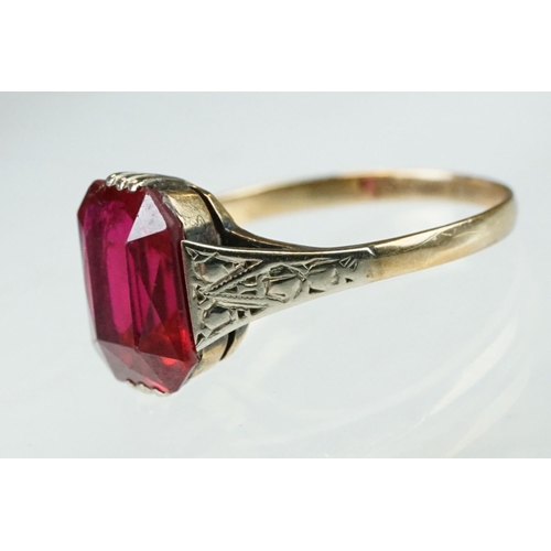 242 - Synthetic ruby 9ct gold dress ring, size L½; paste 9ct yellow gold dress ring, size O together with ... 