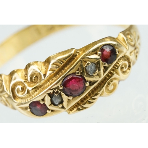 245 - Early 20th century ruby and diamond 18ct yellow gold ring, three small round mixed cut rubies, two s... 