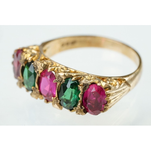 246 - Green tourmaline and synthetic ruby 9ct yellow gold five stone ring, three oval mixed cut synthetic ... 