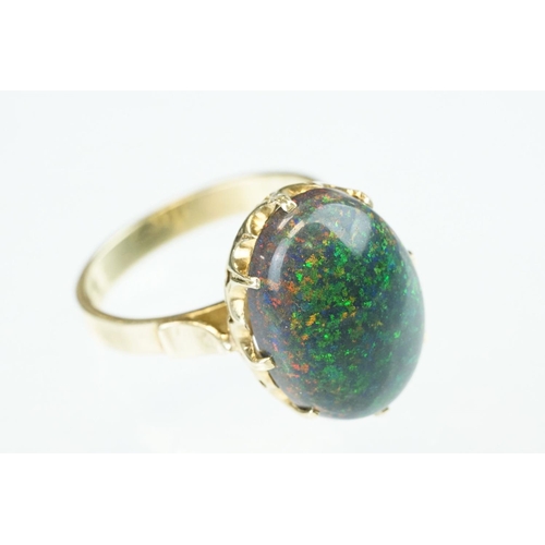 247 - Black sugar opal, yellow metal, stamped 14, ring size M½; a citrine 9ct yellow gold dress ring, size... 