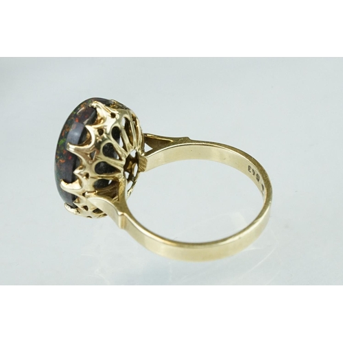 247 - Black sugar opal, yellow metal, stamped 14, ring size M½; a citrine 9ct yellow gold dress ring, size... 