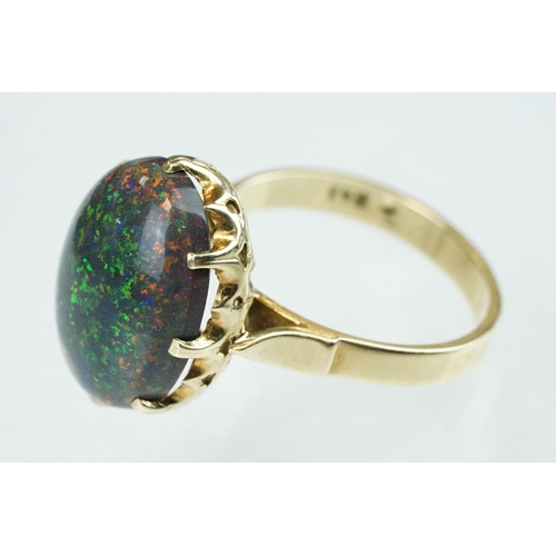 247 - Black sugar opal, yellow metal, stamped 14, ring size M½; a citrine 9ct yellow gold dress ring, size... 