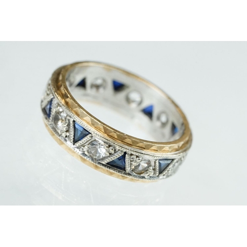 253 - Sapphire and white stone 9ct yellow and white gold eternity ring, ten small triangular mixed cut sap... 