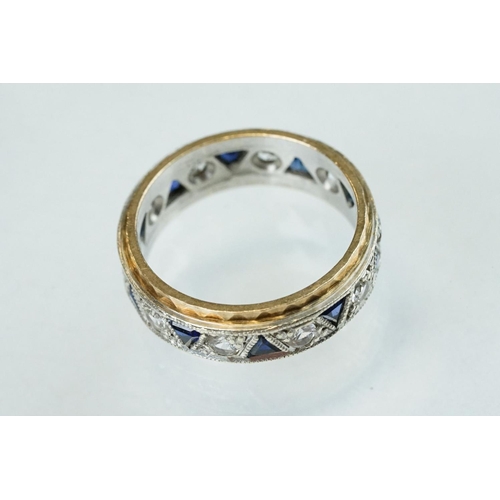 253 - Sapphire and white stone 9ct yellow and white gold eternity ring, ten small triangular mixed cut sap... 