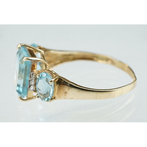 255 - White stone solitaire 9ct yellow gold ring, size N½; blue topaz and diamond 10ct yellow gold ring, t... 