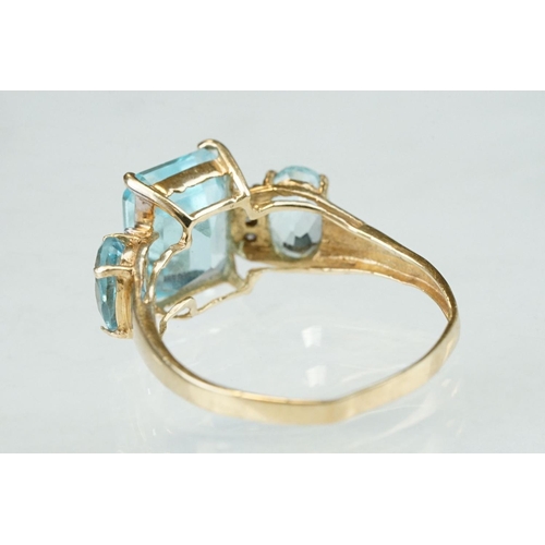 255 - White stone solitaire 9ct yellow gold ring, size N½; blue topaz and diamond 10ct yellow gold ring, t... 