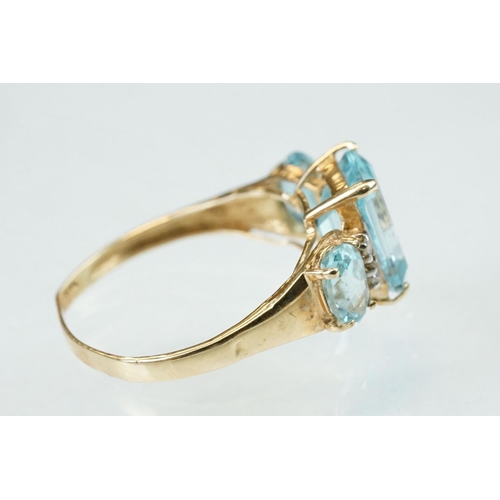 255 - White stone solitaire 9ct yellow gold ring, size N½; blue topaz and diamond 10ct yellow gold ring, t... 