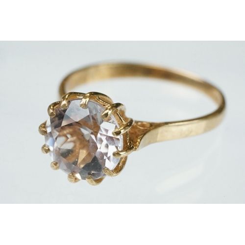 255 - White stone solitaire 9ct yellow gold ring, size N½; blue topaz and diamond 10ct yellow gold ring, t... 