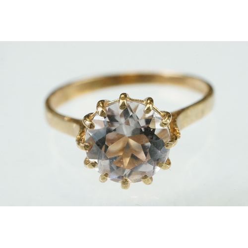 255 - White stone solitaire 9ct yellow gold ring, size N½; blue topaz and diamond 10ct yellow gold ring, t... 