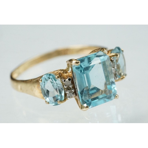 255 - White stone solitaire 9ct yellow gold ring, size N½; blue topaz and diamond 10ct yellow gold ring, t... 