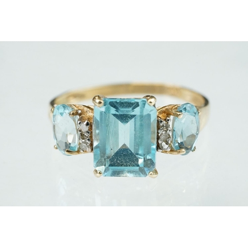 255 - White stone solitaire 9ct yellow gold ring, size N½; blue topaz and diamond 10ct yellow gold ring, t... 