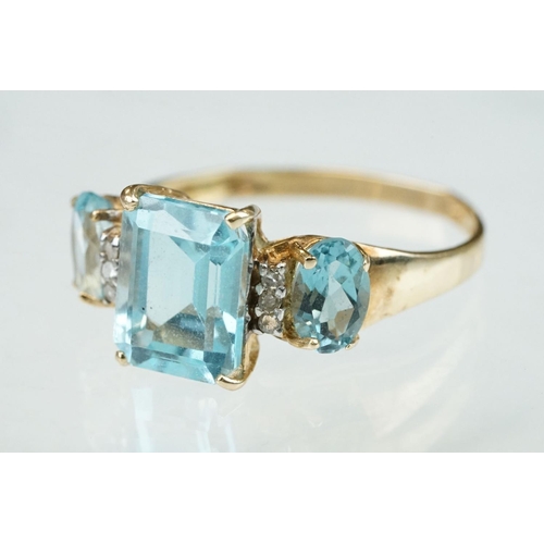 255 - White stone solitaire 9ct yellow gold ring, size N½; blue topaz and diamond 10ct yellow gold ring, t... 