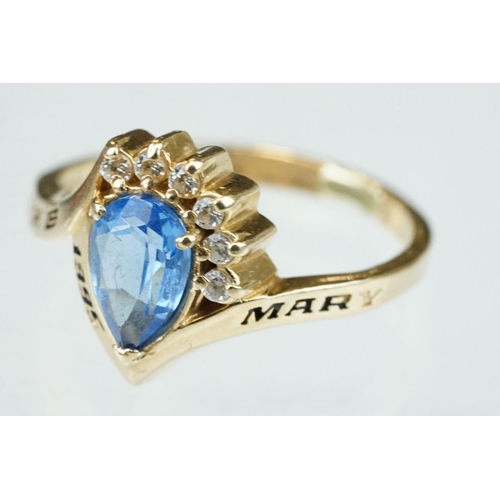 257 - Smoky quartz 9ct yellow gold ring, size Q; rose metal ring of clasped hands, ring size K; and a blue... 